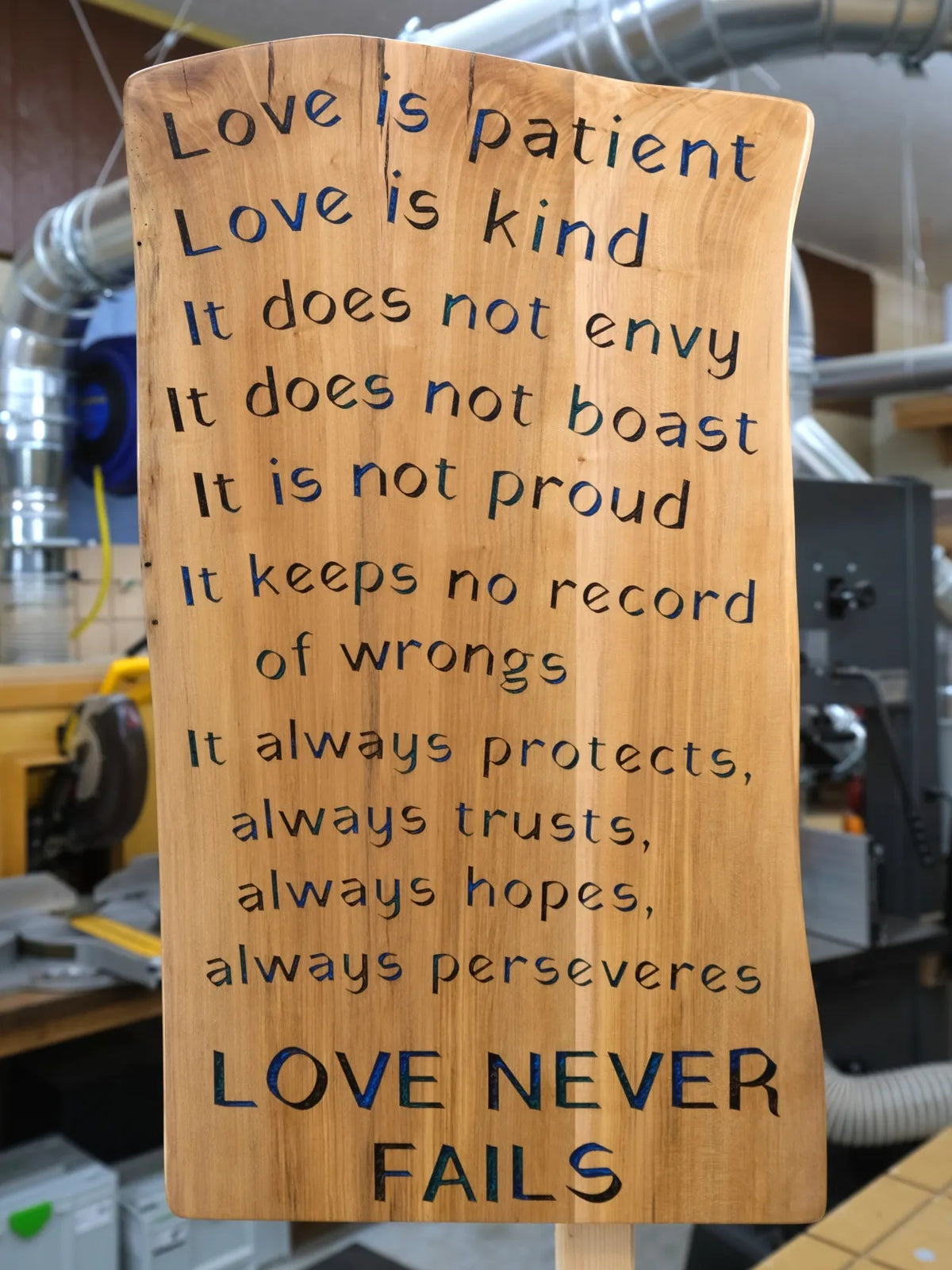 Love Never Fails Wooden Sign with Epoxy Inlay