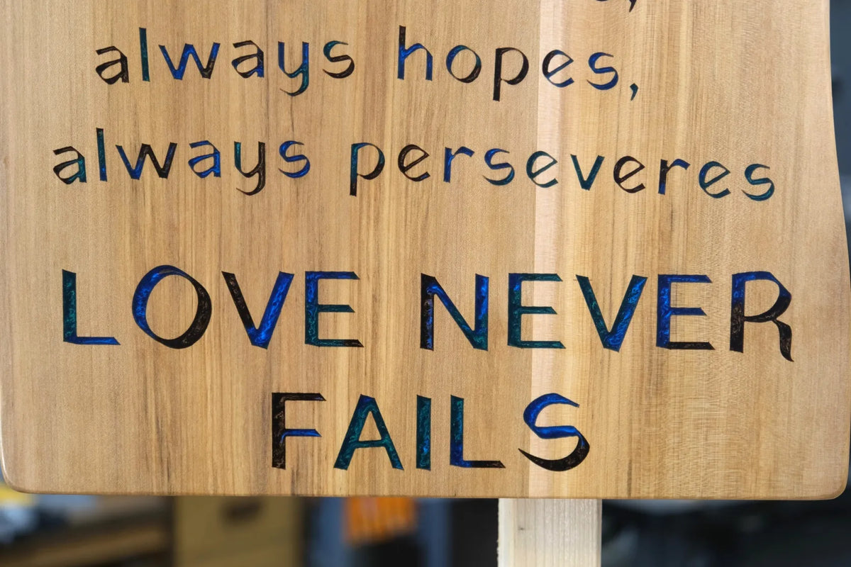 Love Never Fails Wooden Sign with Epoxy Inlay